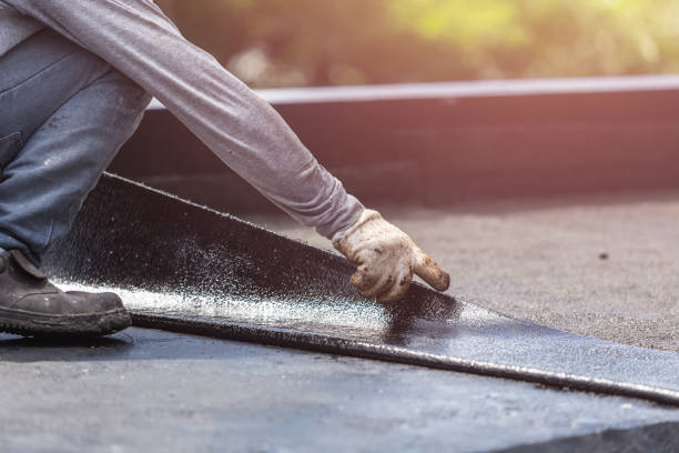 Professional Basement Waterproofing technician working in Walton, IN